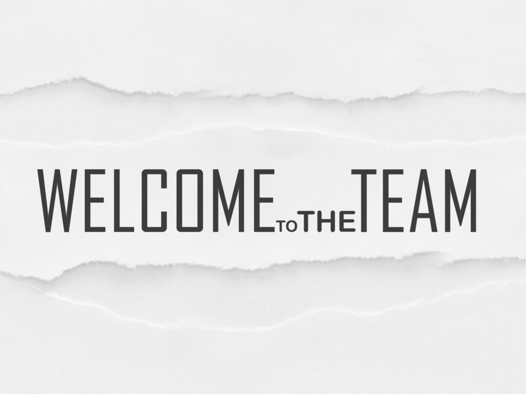 weisser Hintergrund auf dem Welcome to the Team geschrieben ist.
